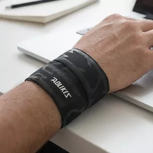 Ultratunt handledsstöd i nylon med kompressionslinda